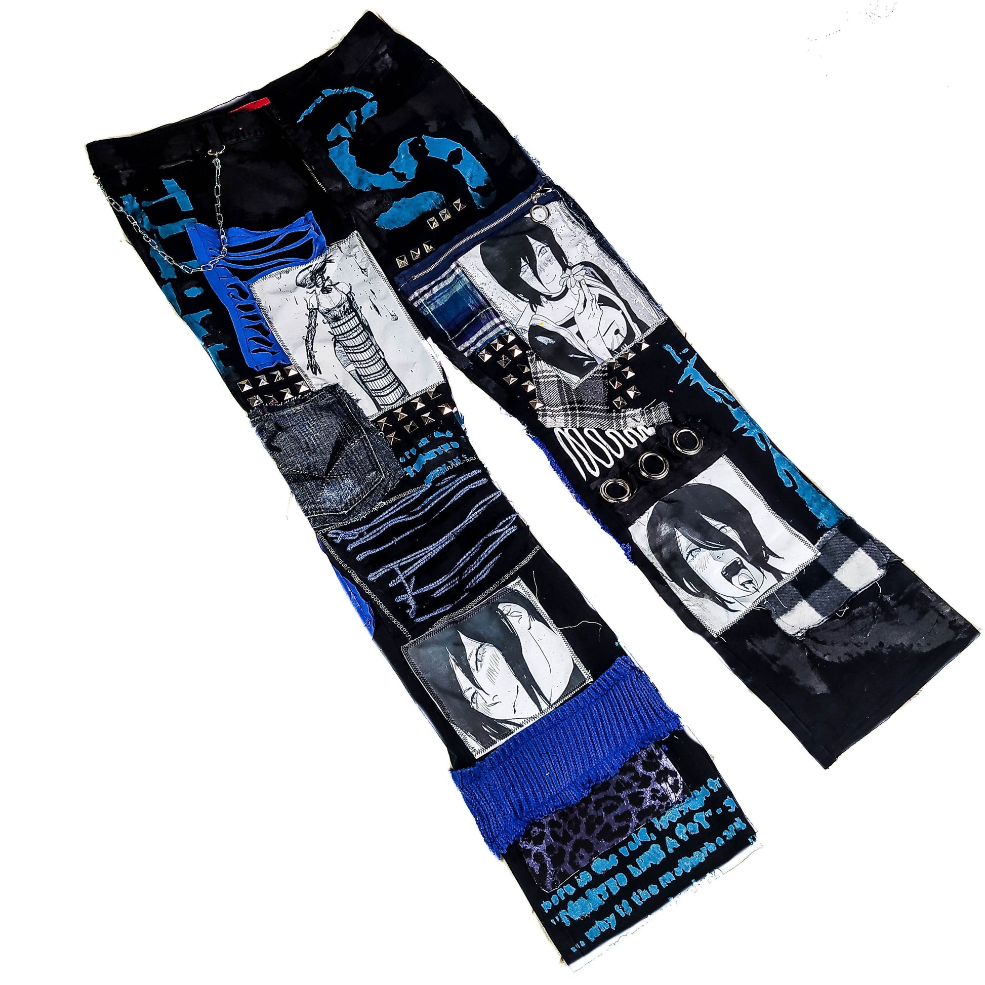 Flat laid black pants with anime prints, colorful patchwork in multiple blue shades, ripped patches, zipper, eyelets, studs and abstract painting with a blue snake on the front.